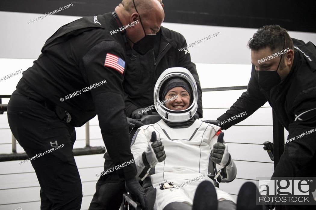 Stock Photo: NASA astronaut Megan McArthur gives a thumbs up after being helped out of the SpaceX Crew Dragon Endeavour spacecraft onboard the SpaceX GO Navigator recovery.