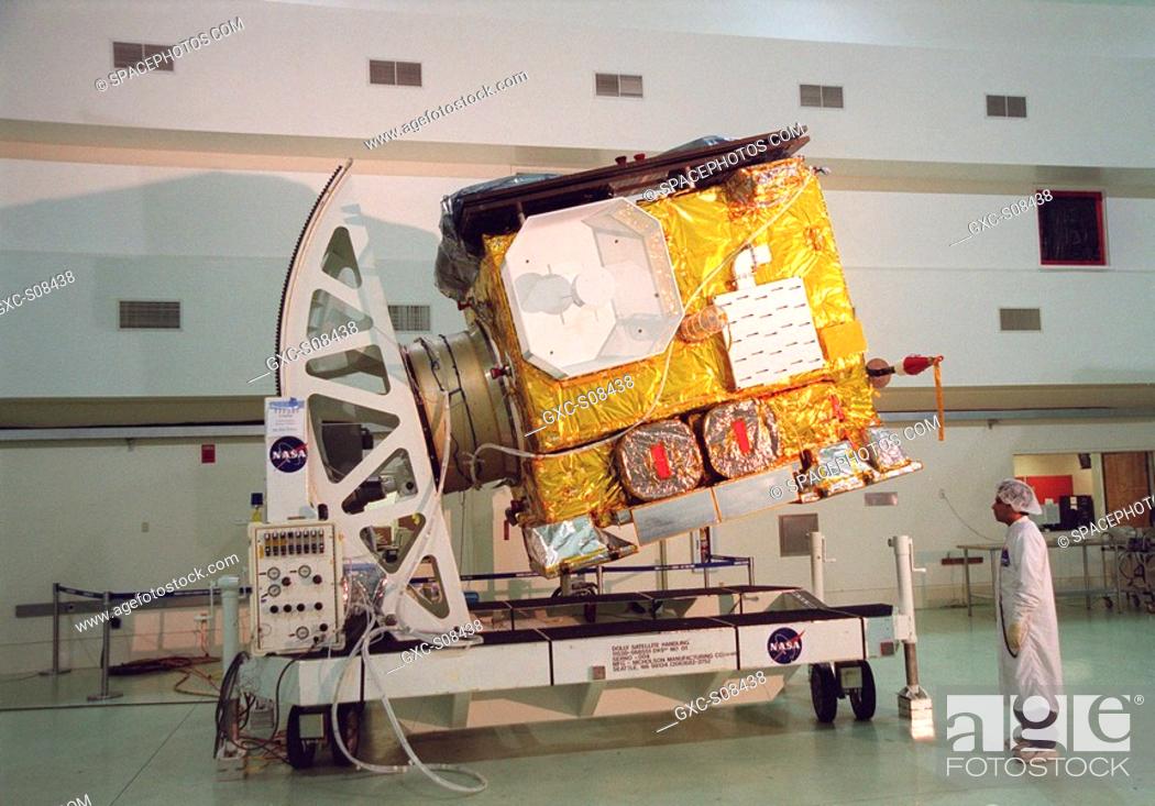 Stock Photo: 05/23/2001 --- The newest Geostationary Operational Environmental Satellite-M GOES-M satellite is rotated at Astrotech, in Titusville for the media who are.