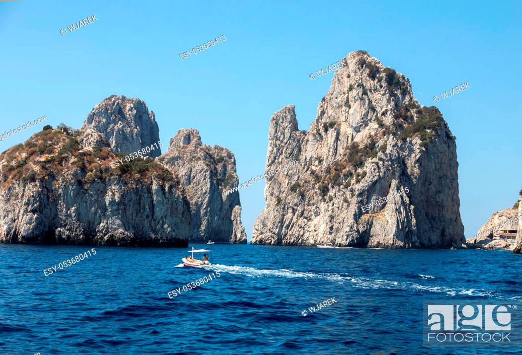 Stock Photo: CAPRI, ITALY - JUNE 13, 2017: View from the boat on the Faraglioni Rocks on Capri Island, Italy.
