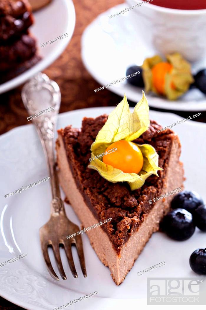 Stock Photo: Chocolate cheesecake with crumb topping and berries.