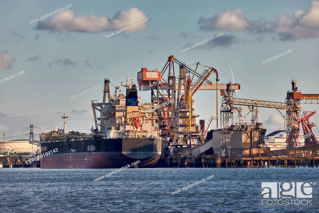 Stock Photo: Cargo ship in an industrial dock.