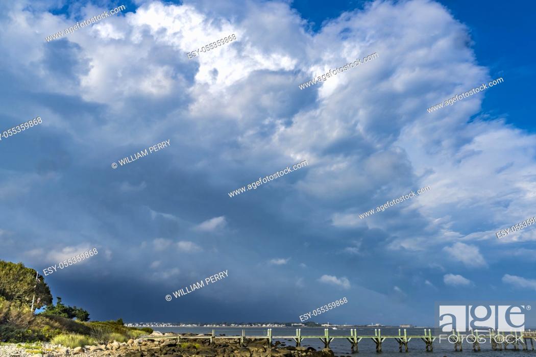 Stock Photo: Storm Coming Beach Pier Buzzards Bay Ocean Padanaram Dartmouth Massachusetts New Bedford and Fort Rodman in distance.