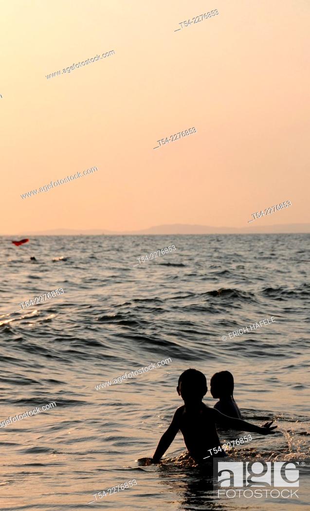 Stock Photo: Children playing on the beach in Sihanoukville.