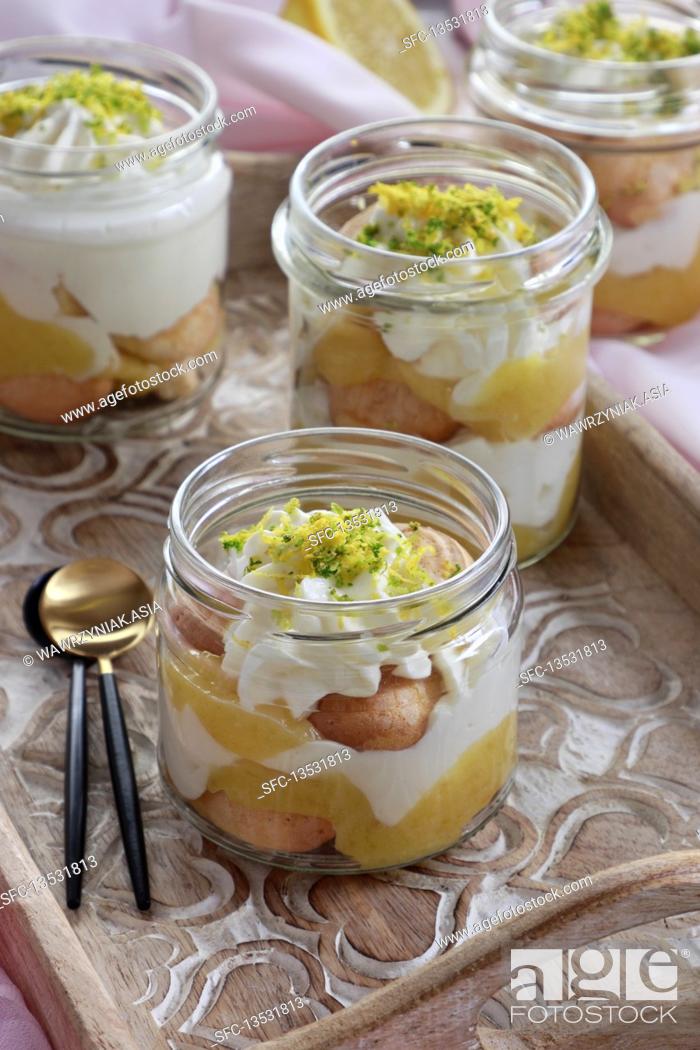 Stock Photo: Lemon curd dessert tiramisu served in jar.