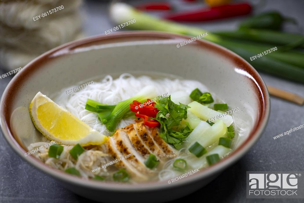 Stock Photo: pho soup with chicken meat and vegetables.
