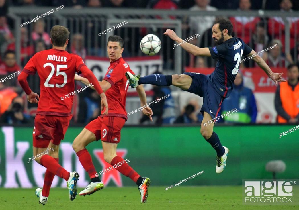 Stock Photo: Munich's Thomas Mueller (L-R) and Robert Lewandowski in action against Madrid's Juanfran Torres during the UEFA Champions League semi final second leg soccer.