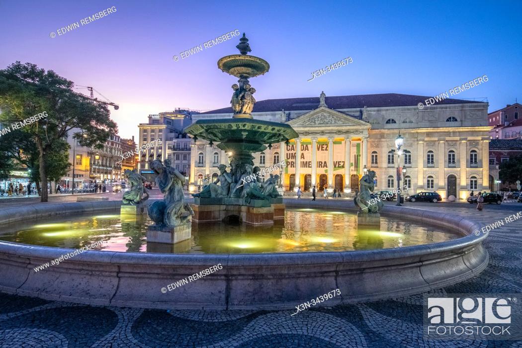 Stock Photo: Lit Fountain at Night in the Rossio Square , Lisbon, Portugal.