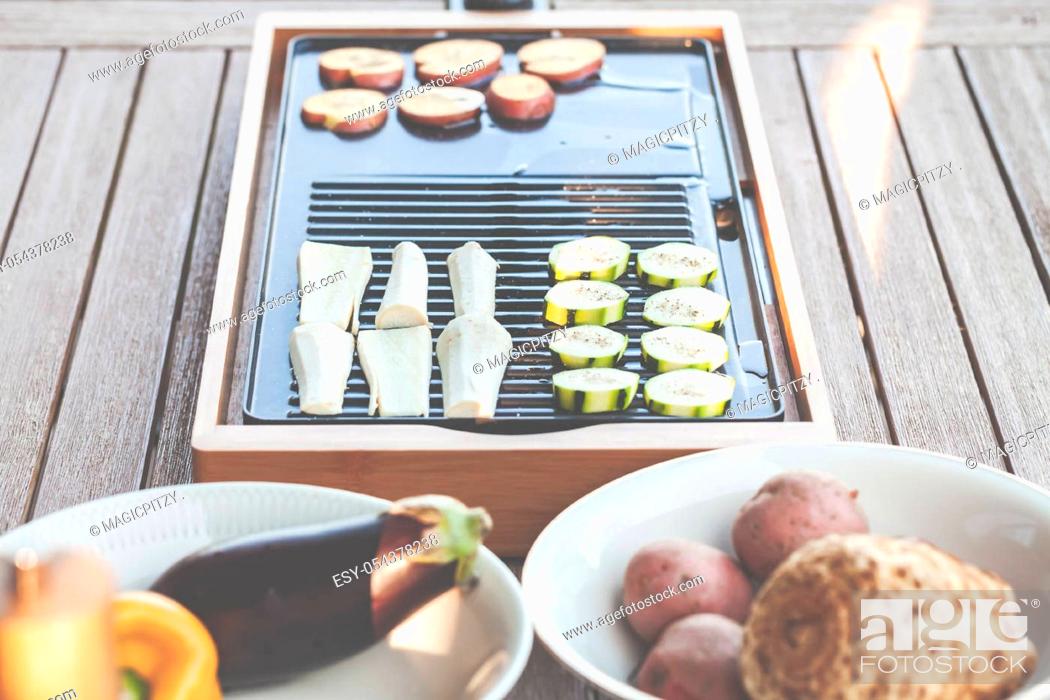Stock Photo: The barbecue evening: it can also be vegetarian, with delicious cucumber salad and grilled vegetables.