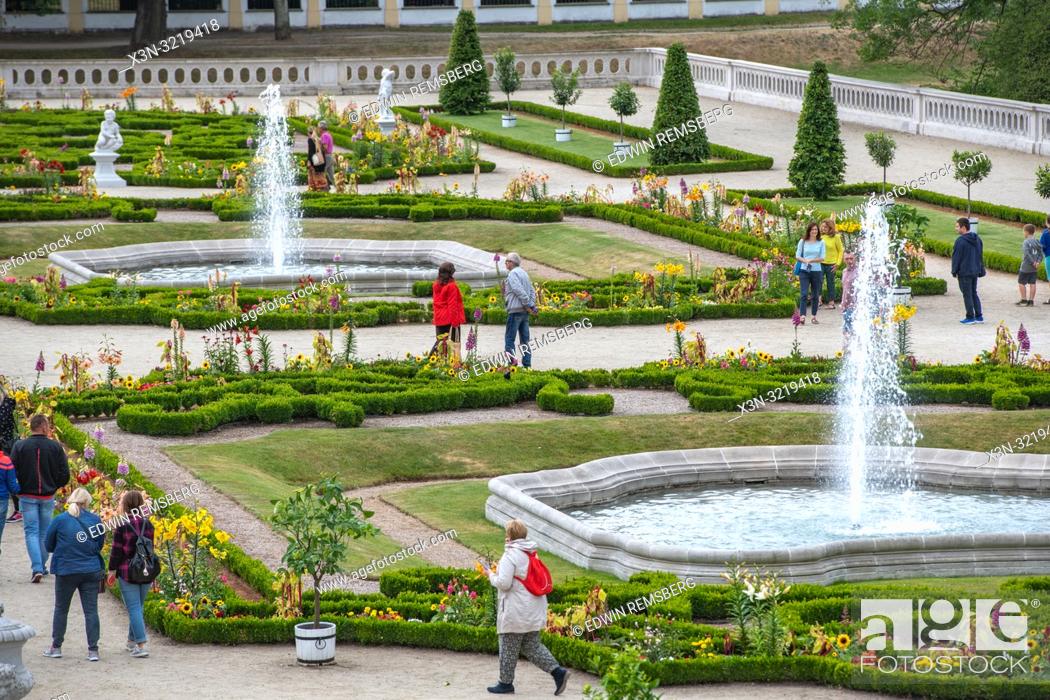 Stock Photo: Tourist walk through the gardens at Branicki palace in Bialystok, Poland.