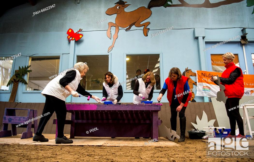 Stock Photo: Princess Beatrix and Princess Aime, members of the Dutch Royal Family, volunteering for people with disabilities at a Manege in Den Dolder, Netherlands.