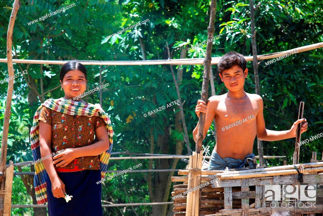Stock Photo: A Marma tribal family at the back yard of their house Khagrachori, Bangladesh May 9, 2007.