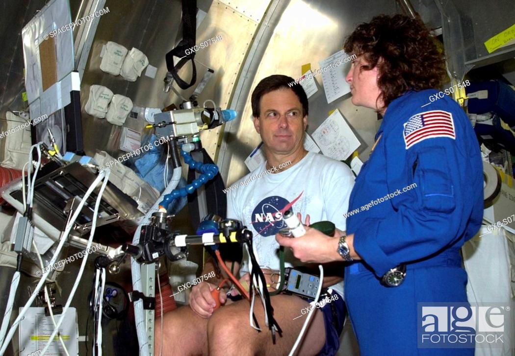 Stock Photo: 12/19/2001 - STS-107 Payload Specialist Ilan Ramon, from Israel, pauses during an experiment at SPACEHAB, Cape Canaveral, Fla.