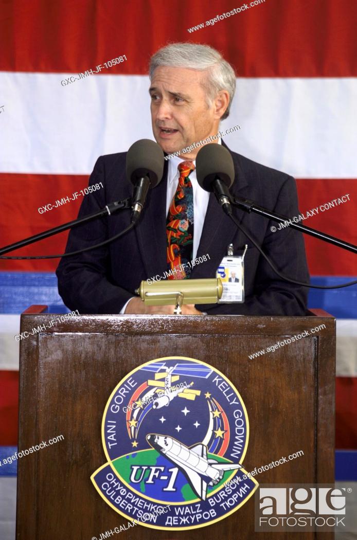 Stock Photo: Johnson Space Center's (JSC) Acting Director Roy S. Estess speaks from the podium in Hangar 990 at Ellington Field during the STS-108 and Expedition Three crew.