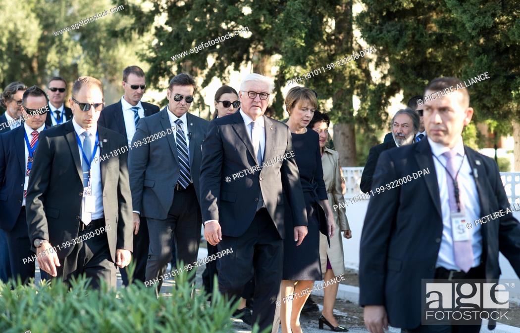 Stock Photo: 11 October 2018, Greece, Athens: President Frank-Walter Steinmeier and his wife Elke Büdenbender are led by Michalis Selekos (r), Mayor of Chaidari.