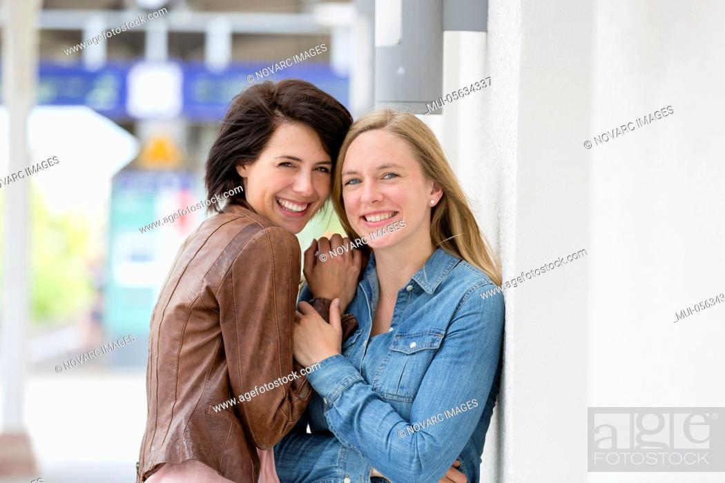 Stock Photo: Two friends laugh together and talk.