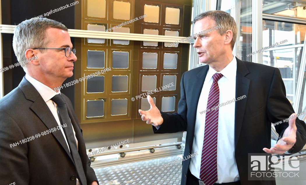 Stock Photo: Frank Averdung (R), CEO of Oxford Photovoltaics Germany GmbH, shows the company to Brandenburg's Economics Minister Albrecht Gerber (SPD) in Brandenburg an der.