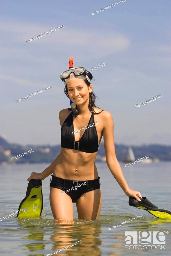 Stock Photo: woman with snorkelling equipment at the lake.