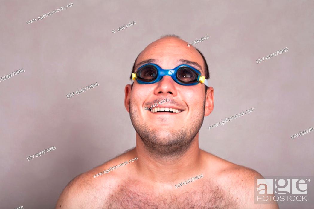 Closeup of funny naked man in swimming goggles daydreaming and looking up,  Stock Photo, Picture And Low Budget Royalty Free Image. Pic. ESY-026970886  | agefotostock