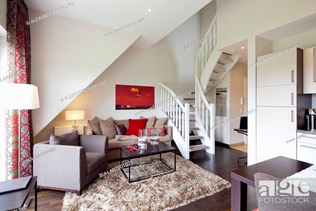 Stock Photo: Interior of a contemporary living room with staircase.