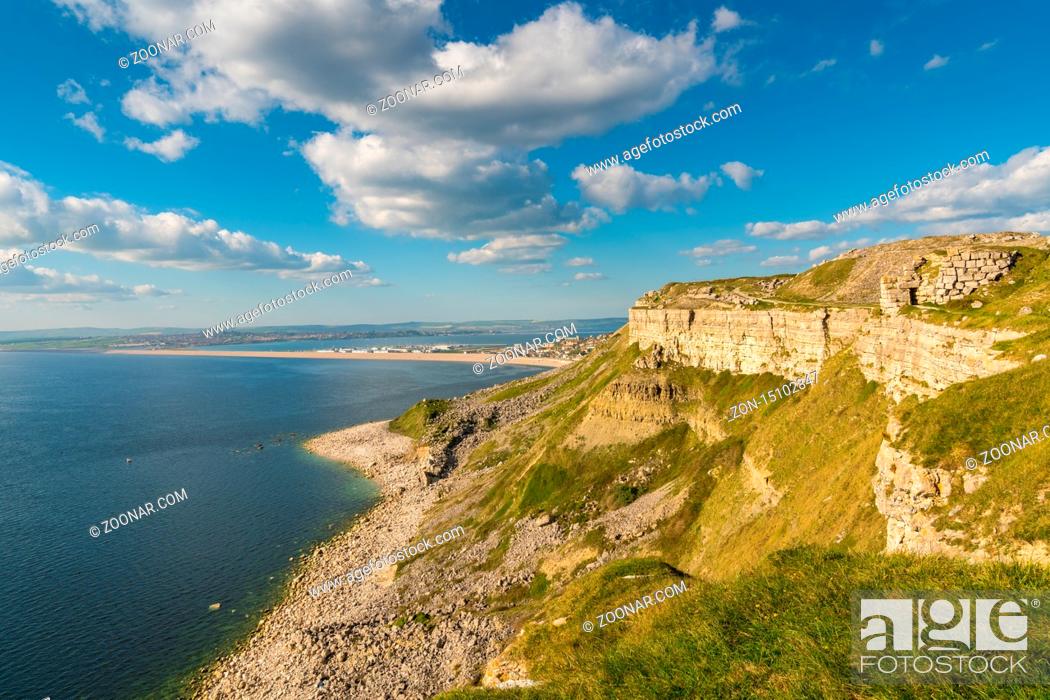 Stock Photo: View from the South West Coast Path towards Fortuneswell and Chesil Beach, Isle of Portland, Jurassic Coast, Dorset, UK - with clouds over Weymouth in the.