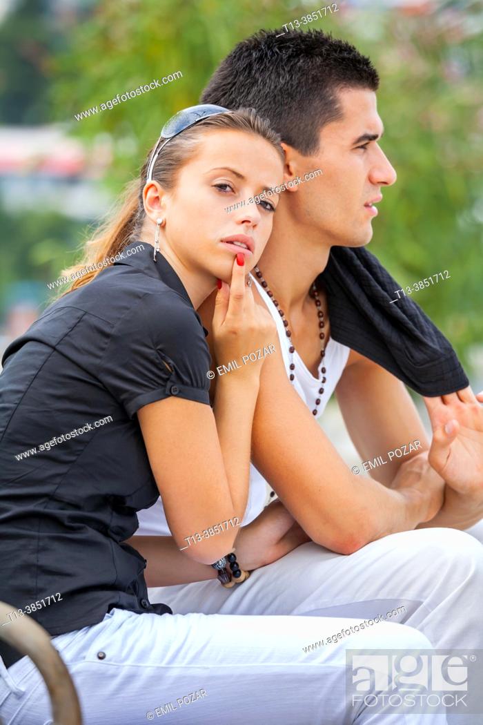 Stock Photo: Teenage girl and boy together in a park.