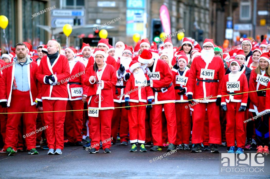 Stock Photo: The annual Santa Dash in which 7, 500 people take to the streets in Glasgow in Santa suits for charity. Featuring: atmosphere Where: Glasgow.