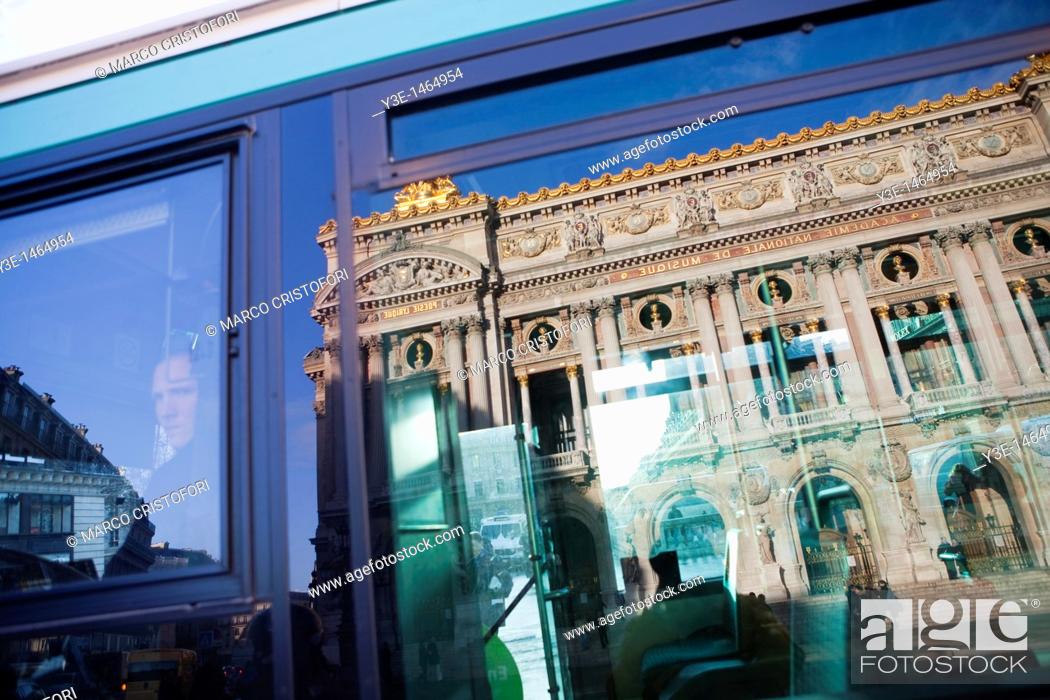 Stock Photo: Opera Garnier building reflecting in a window bus Paris France.