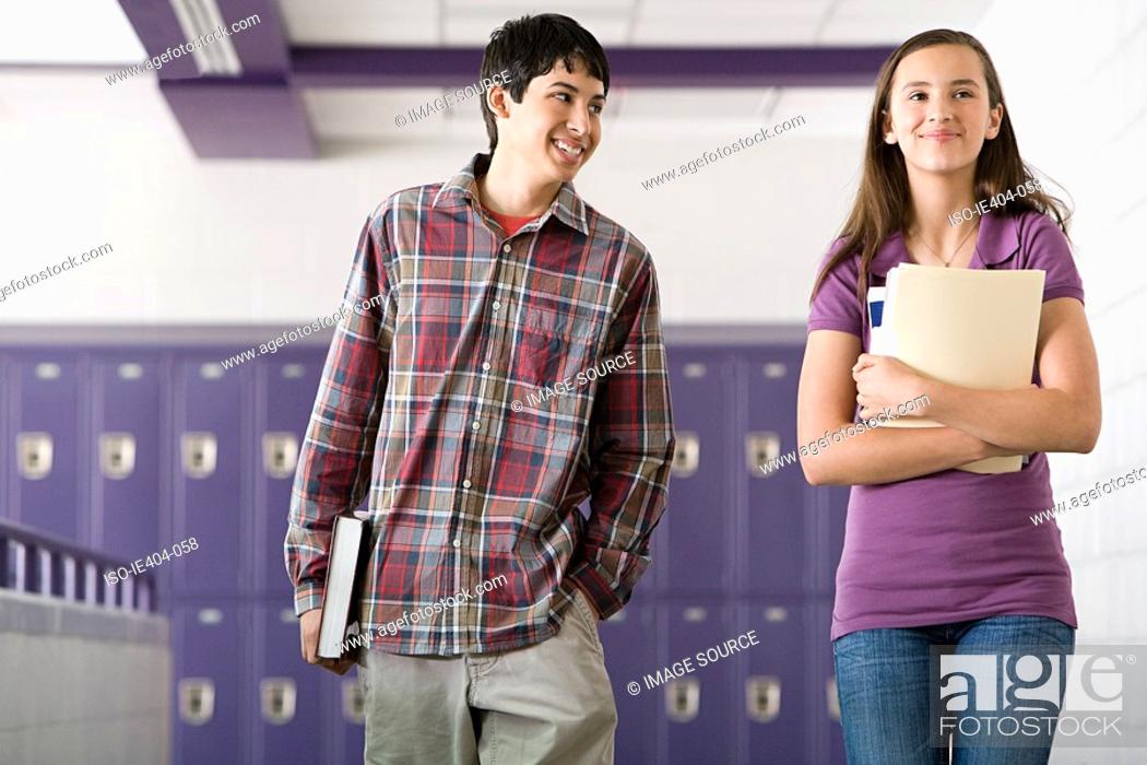 Stock Photo: High school students walking down a corridor.
