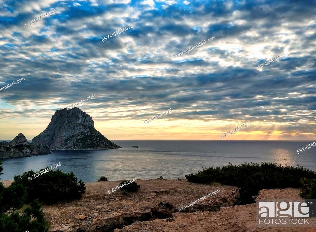 Stock Photo: Picturesque view of the mysterious island of Es Vedra at sunset. Ibiza Island, Balearic Islands. Spain.