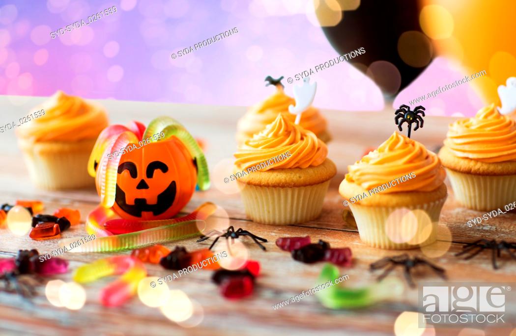 Stock Photo: halloween party cupcakes or muffins on table.