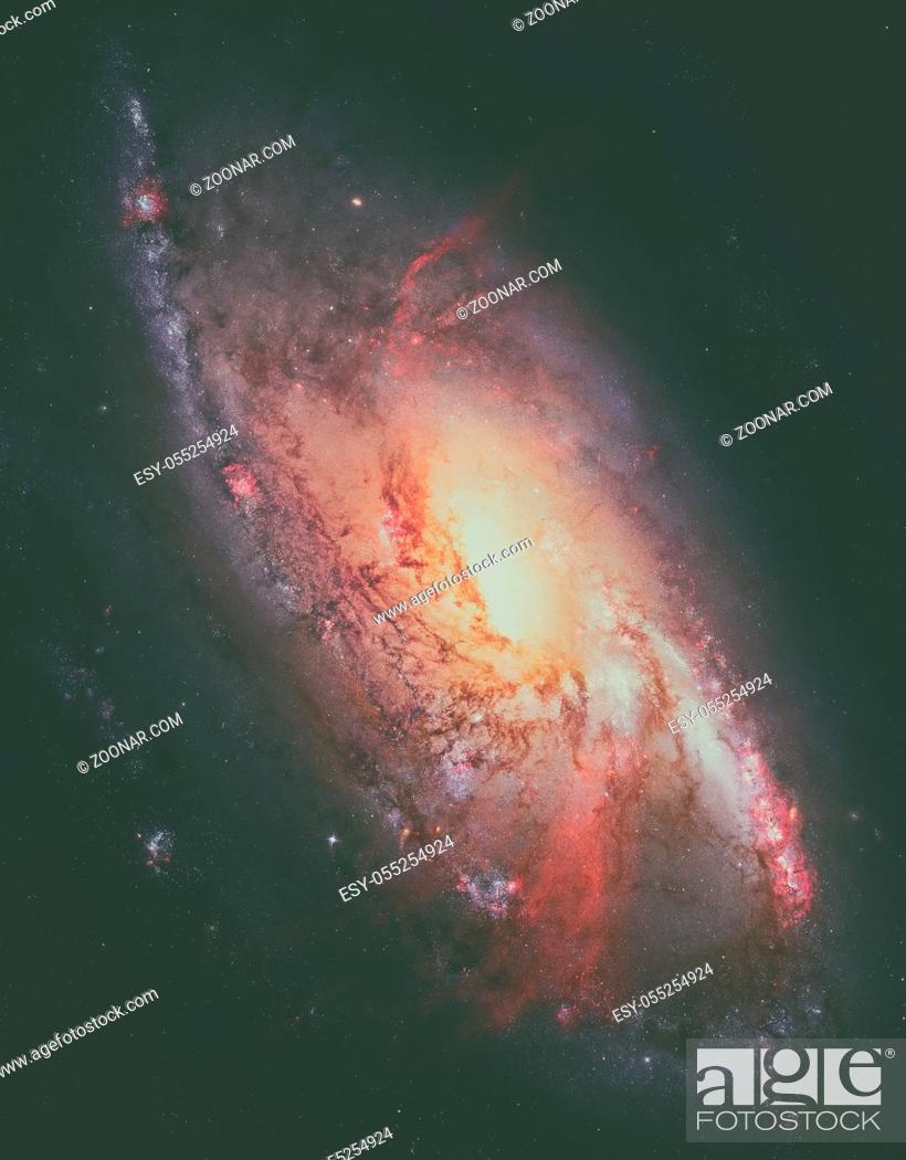 Stock Photo: M106, Spiral Galaxy. Also known as NGC 4258, M106 lies 23.5 million light-years away, in the constellation Canes Venatici.