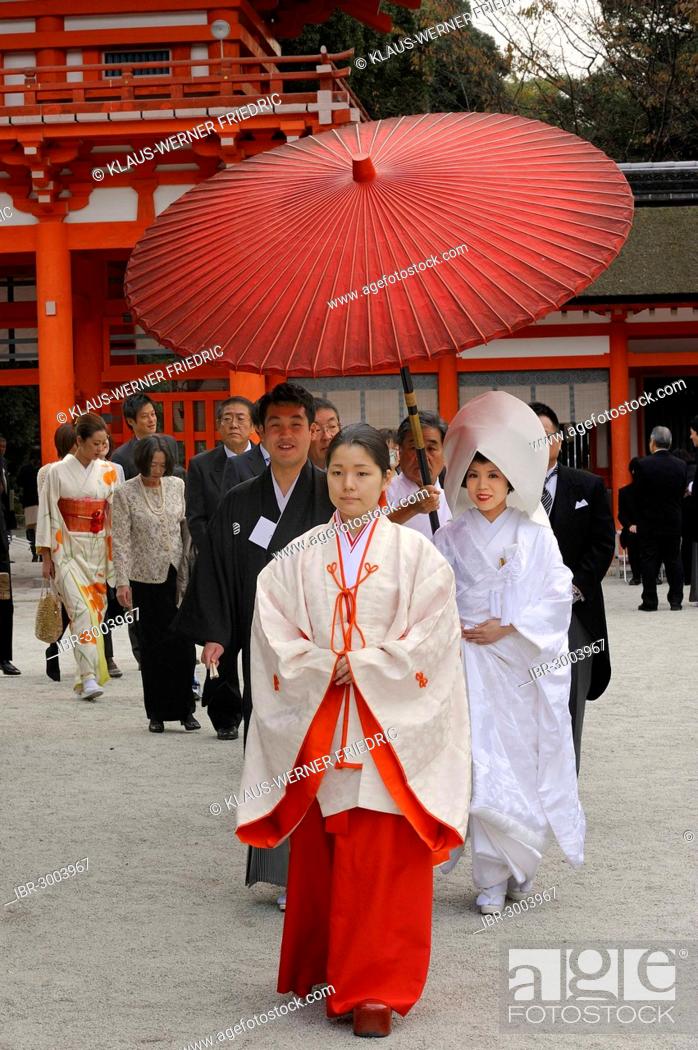 Japanese woman wearing scarlet hakama pants and a white kimono shirt ...