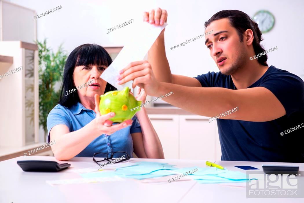 Stock Photo: Female retiree and her young son in budget planning concept.