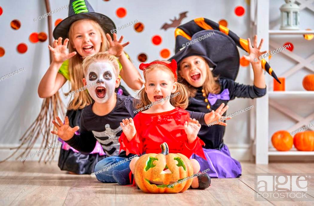 Happy brother and three sisters on Halloween. Funny kids in carnival  costumes indoors, Stock Photo, Picture And Low Budget Royalty Free Image.  Pic. ESY-042856140 | agefotostock