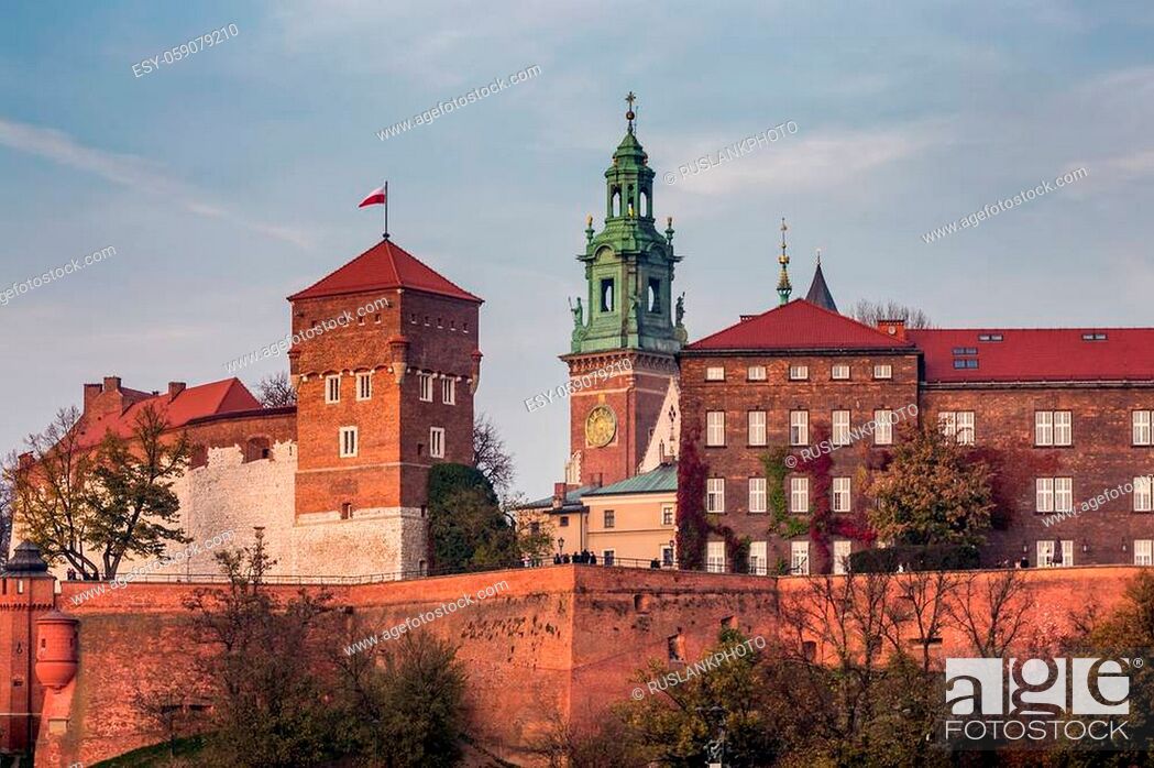 Stock Photo: Wawel castle from opposite riverside upon Krakow old city center at sunset time in Krakow, Poland.