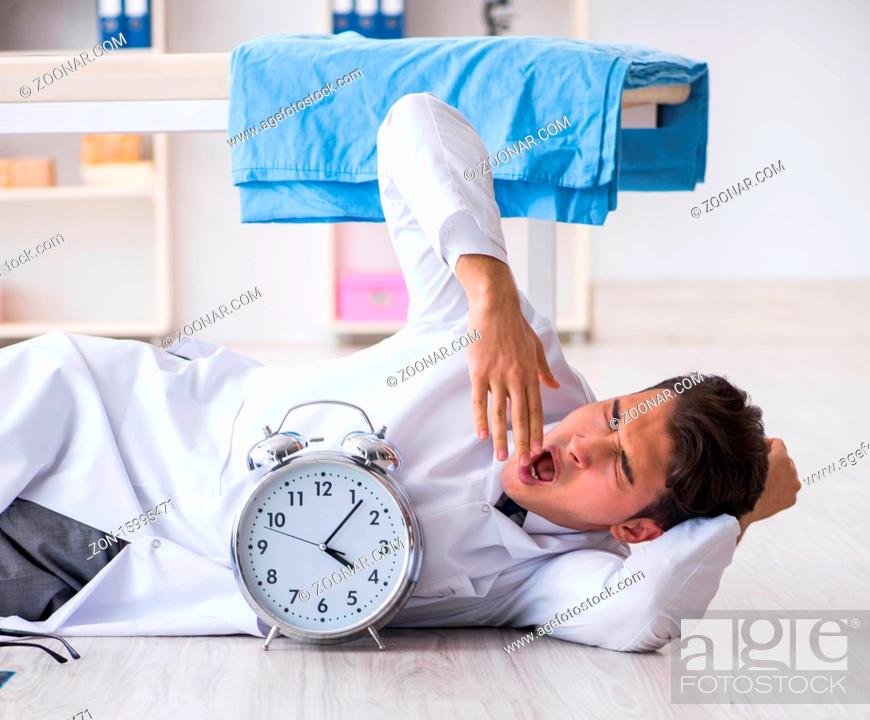 Stock Photo: The sleepy doctor tired after long night shift.