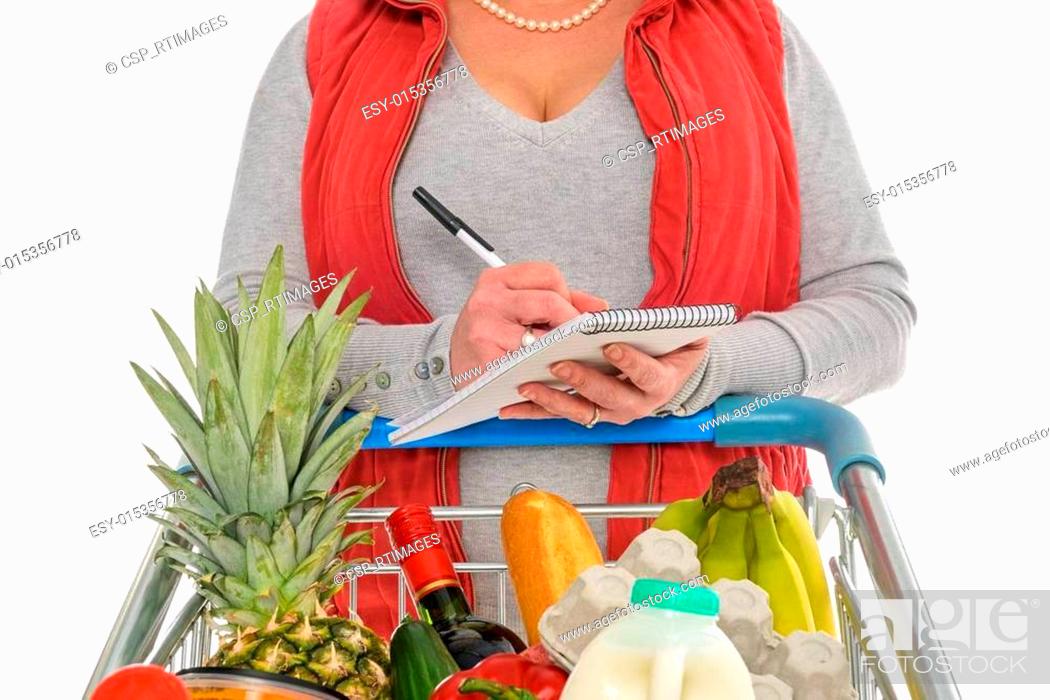 Stock Photo: Woman checking her food shopping list.