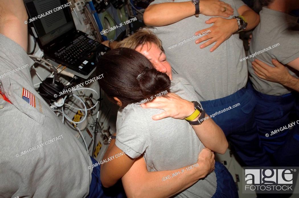 Stock Photo: Astronauts Stephanie Wilson (right), STS-120 mission specialist, and Peggy Whitson, Expedition 16 commander, exchange hugs during a farewell ceremony in the.