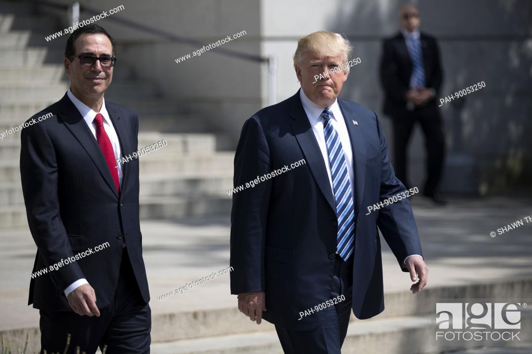 Stock Photo: US President Donald J. Trump (R) and Secretary of Treasury Steven Mnuchin (L) walk out of the Treasury Department after a financial services Executive Order.