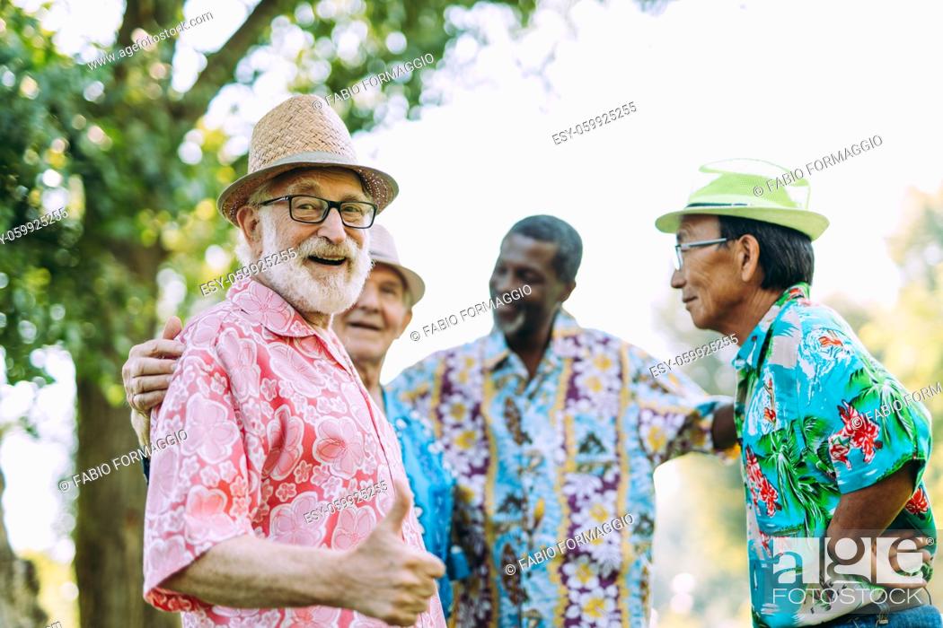 Stock Photo: group of senior friends playing at the park. Lifestyle concepts about seniority and third age.