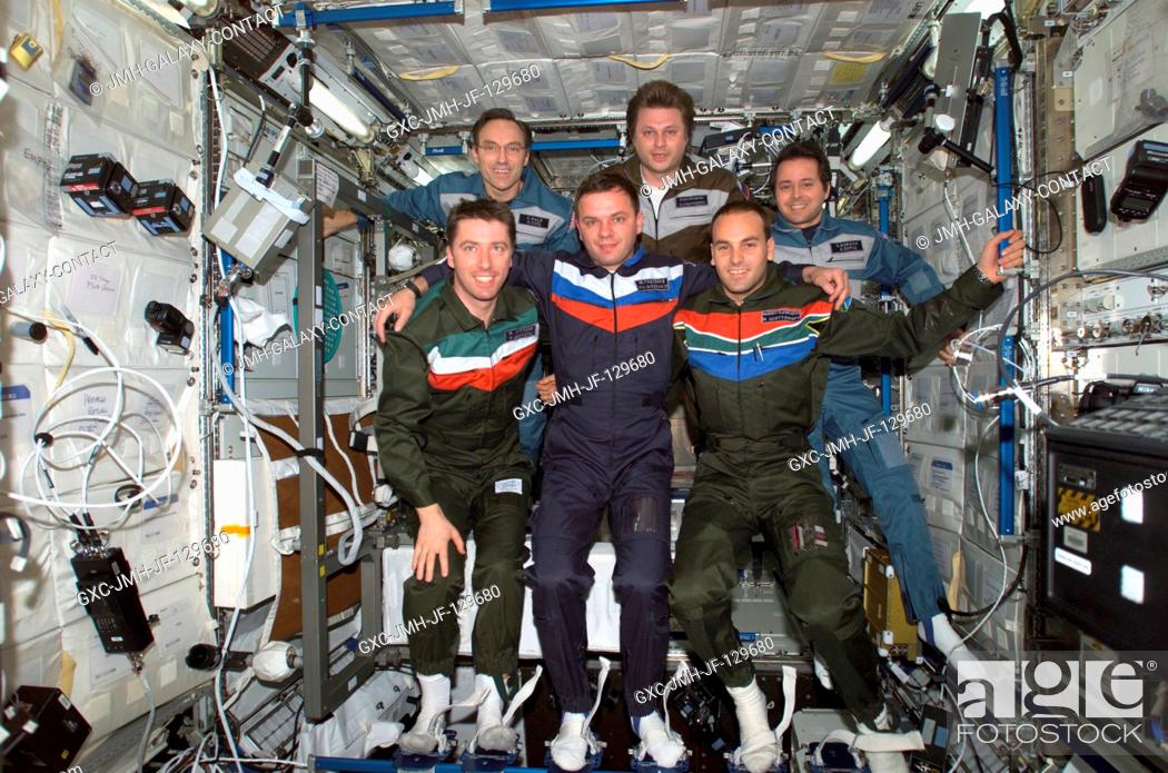 Stock Photo: The Expedition Four and Soyuz 4 Taxi crews pose for a group photo in the Destiny laboratory on the International Space Station (ISS).