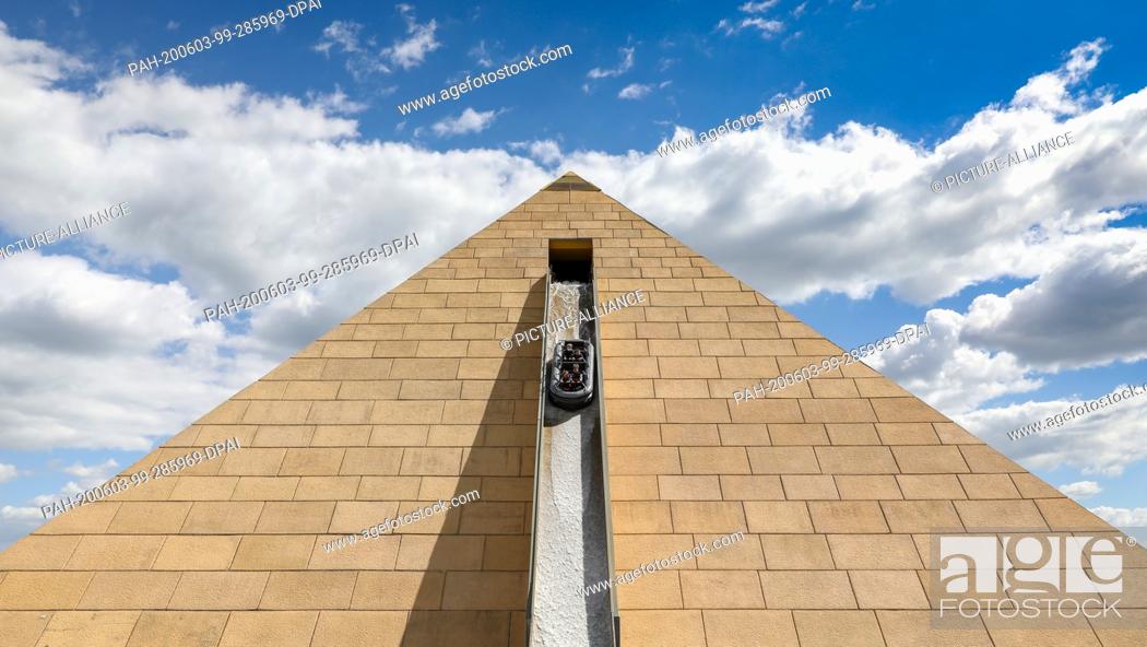 Stock Photo: 29 May 2020, Saxony, Leipzig: Visitors take a ride on the boat slide ""Curse of the Pharaoh"" in the amusement park Belantis.