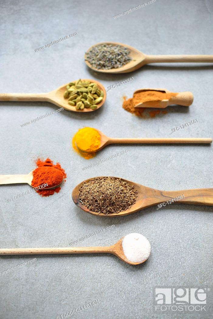 Stock Photo: Spice on a spoon (lavender, cardamom, cinnamon, turmeric, capsicum, cumin, salt).