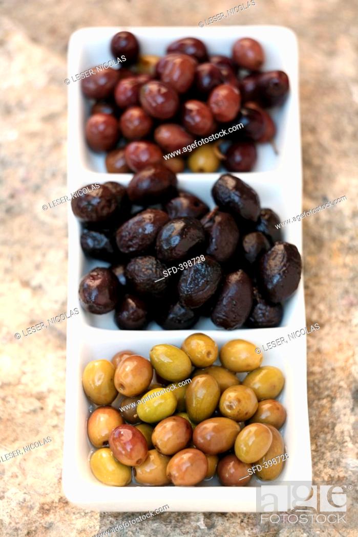Stock Photo: Three different types of olives.