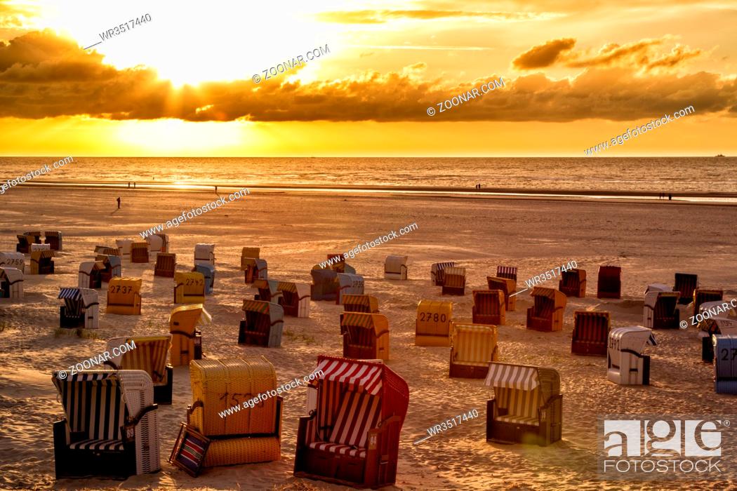 Stock Photo: Sonnenuntergang über dem Strand auf der Nordseeinsel Juist in Ostfriesland, Deutschland, Europa. Sunset and dramatic sky over the beach on the north sea island.