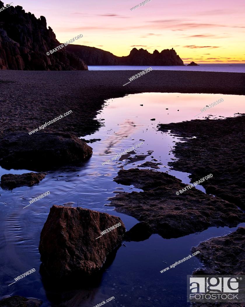 Stock Photo: Early morning on the beach looking out towards Logan Rock at Porthcurno, Cornwall, England, United Kingdom, Europe.