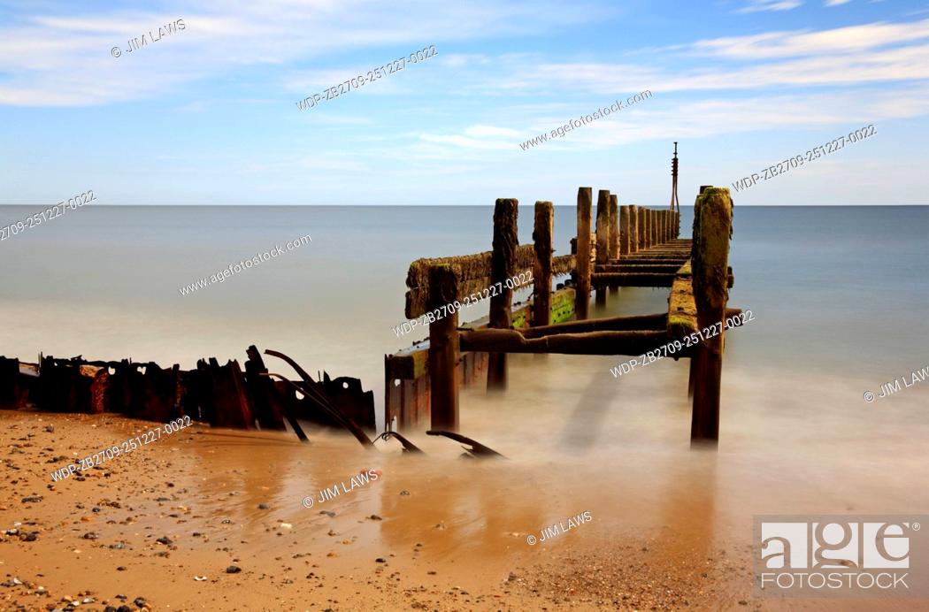 Stock Photo: A creative view of an old breakwater at Cart Gap near Happisburgh on the Norfolk coast, England, United Kingdom.