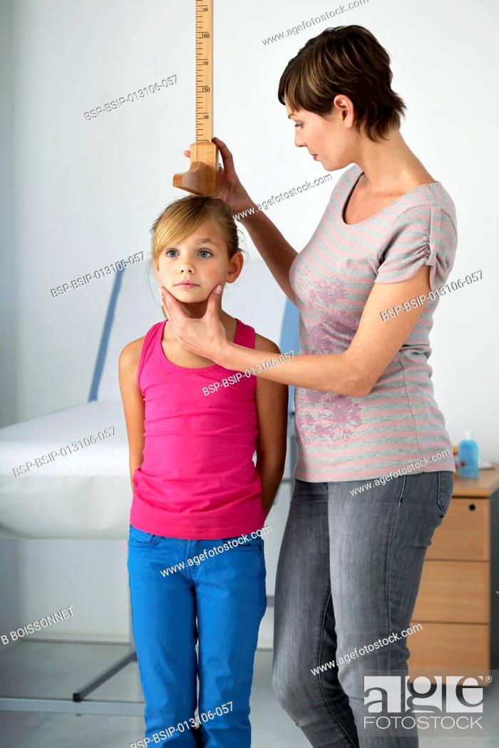 Stock Photo: MEASURING HEIGHT IN A CHILD.