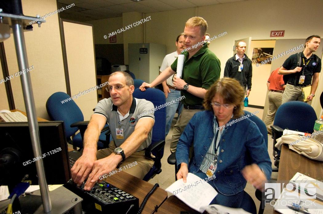 Stock Photo: Astronauts Donald R. Pettit (left), STS-126 mission specialist; Eric A. Boe (standing), pilot; and Sandra H. Magnus, Expedition 18 flight engineer.
