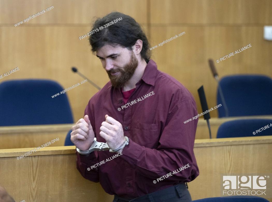 Stock Photo: 15 July 2022, Hessen, Frankfurt/Main: The defendant Franco A. stands handcuffed behind the dock in the high-security room of the Higher Regional Court.